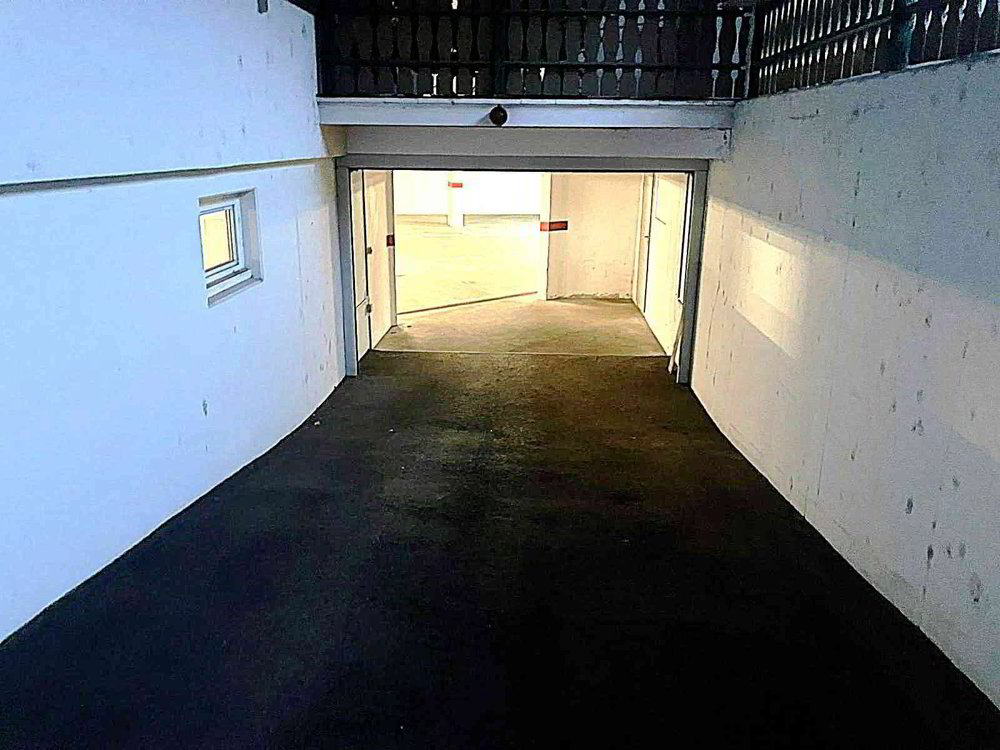 Places de parc dans garage souterrain chauffé, à 5 min. de Delémont - Ansicht 4