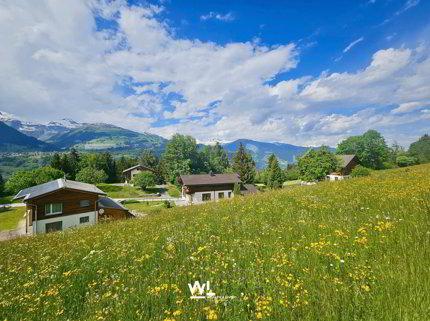 820 m² sonniges Bauland mit Bergpanorama in Obersaxen Mundaun 1/3